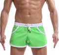 Summer men's quick-dry polyester sports shorts in multiple colours including black, green, and red for beach and casual wear.