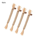 Three natural silvervine chew sticks for cats on wooden surface