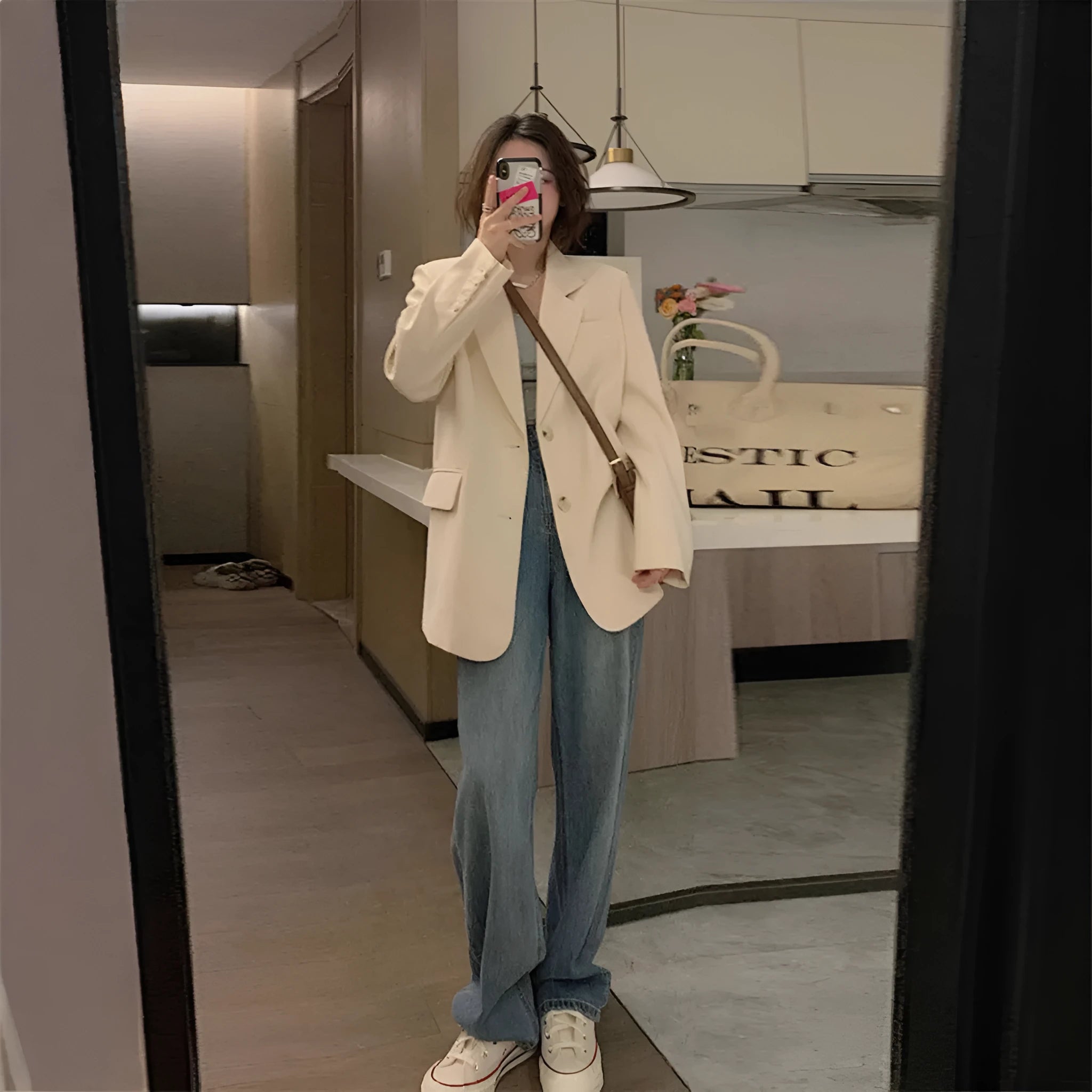 Men's beige Korean-style casual suit jacket with long sleeves and a chest pocket on a hanger.