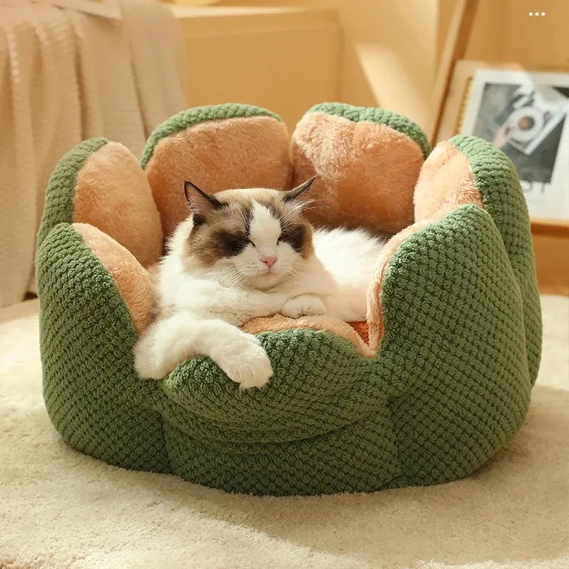 Green cactus-shaped enclosed pet kennel with soft plush interior, shown on a hardwood floor.