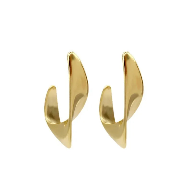 Twisted geometric metal earrings with electroplated gold or silver finish and round shape