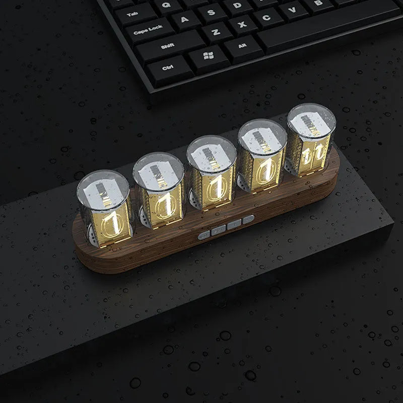 RGB LED digital tube clock showing colourful display with black plastic casing on wooden desk
