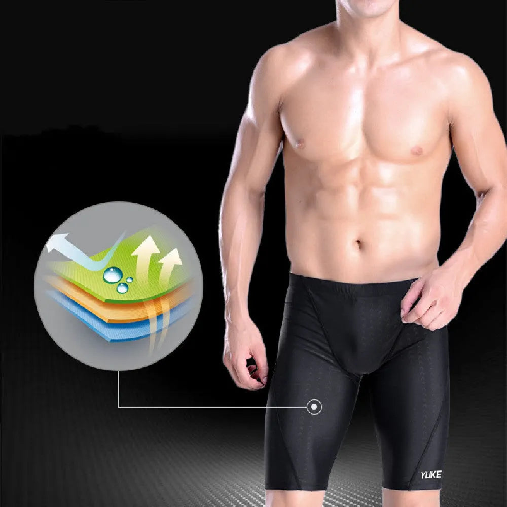 Men's black swimming set with trunks, anti-fog goggles, waterproof cap, ear plugs with nose clip, and carry bag