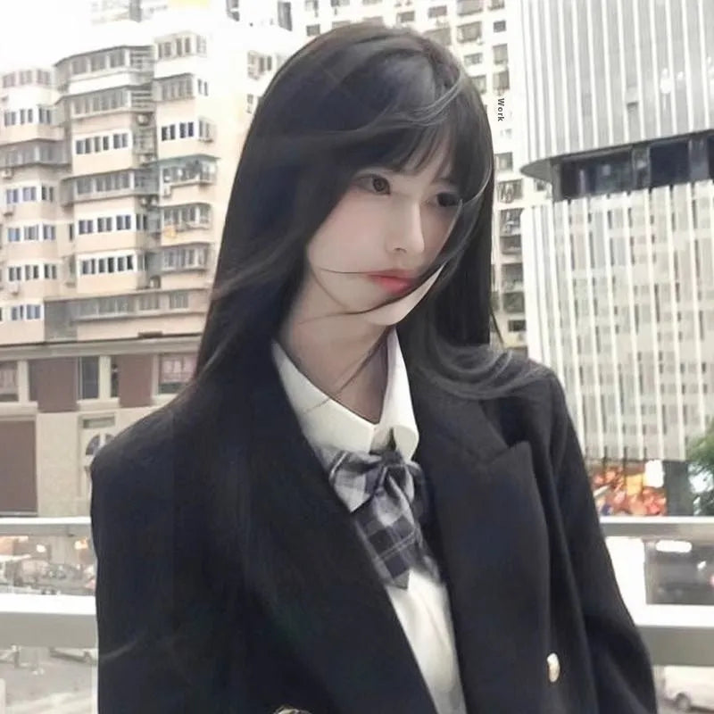 Long straight black synthetic wig with bangs on display model