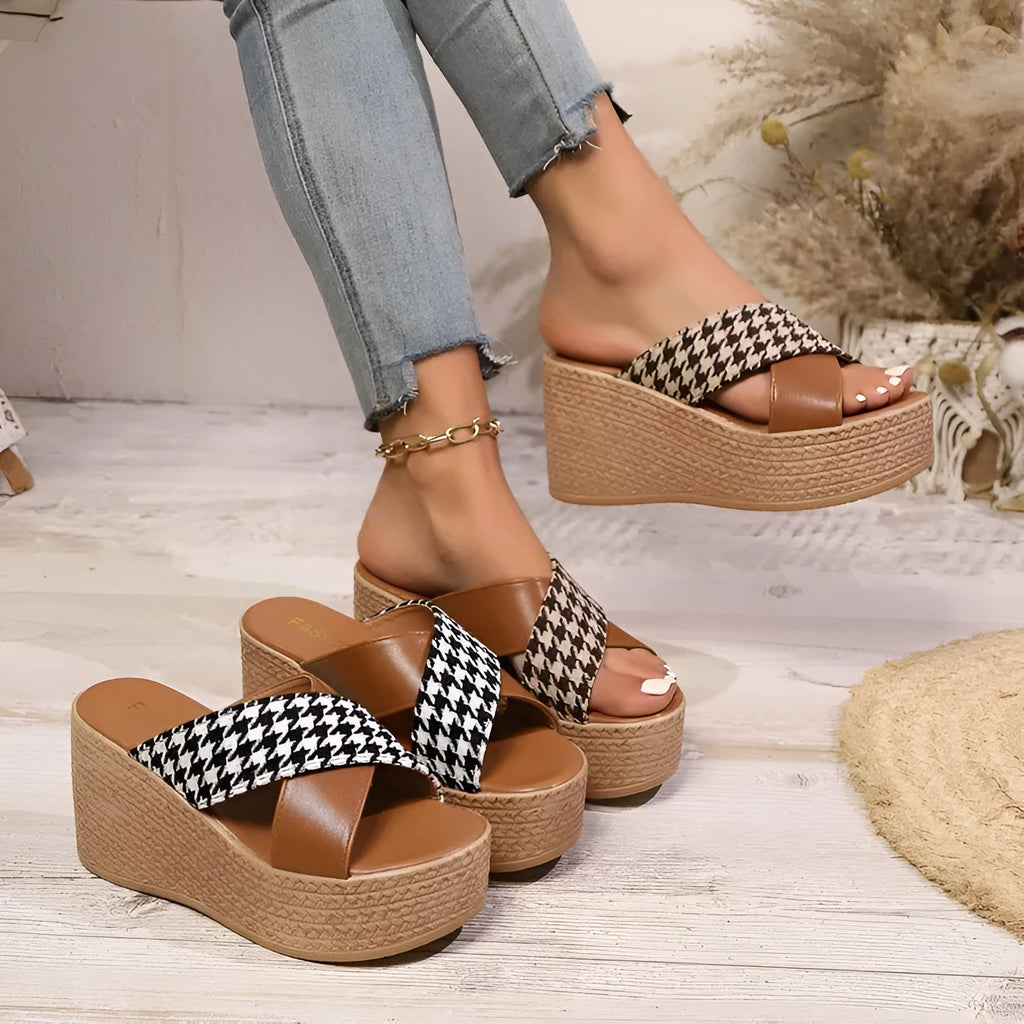 Brown and black plaid wedge sandals with a cross-leopard pattern and a low rubber sole.