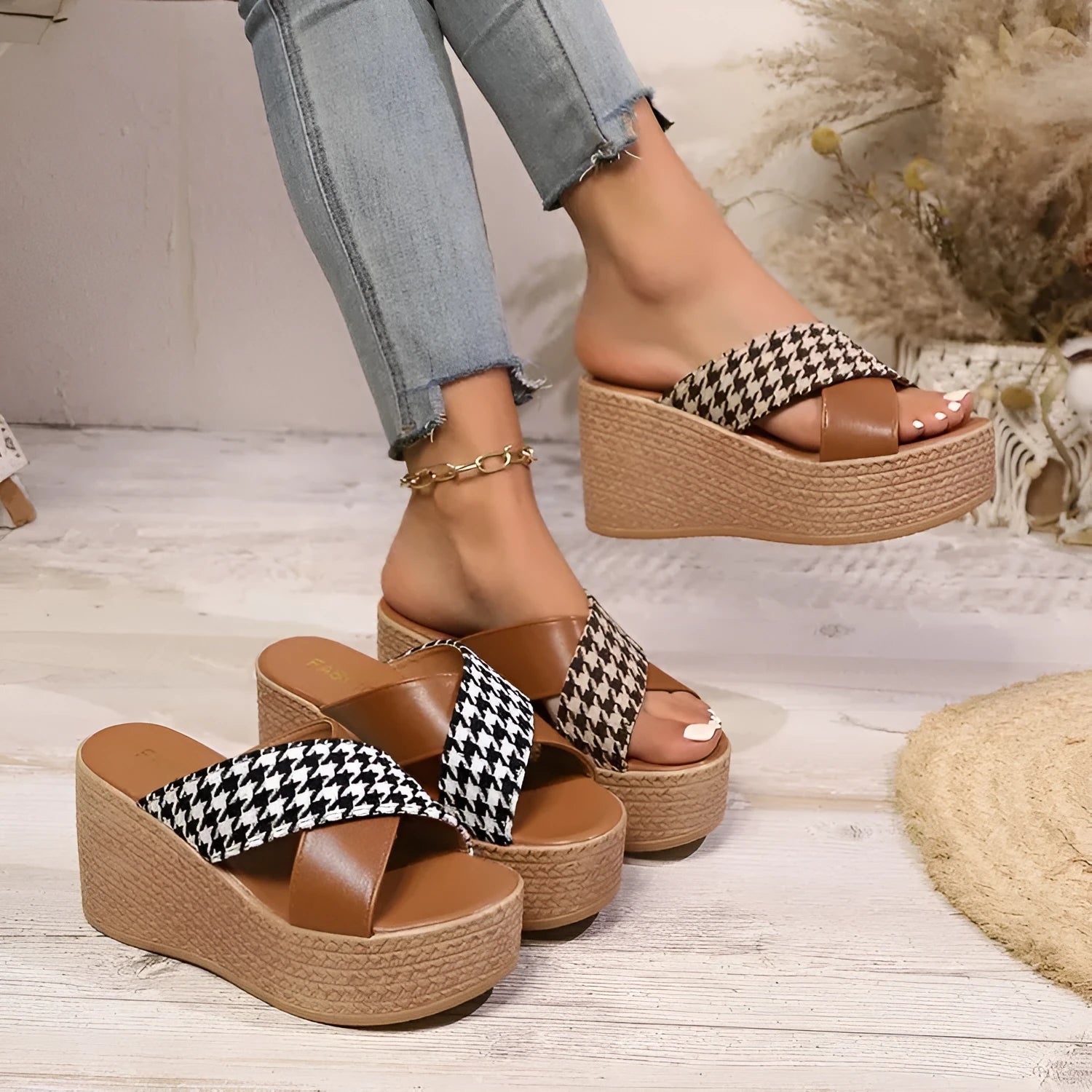Brown and black plaid wedge sandals with a cross-leopard pattern and a low rubber sole.