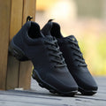 Men's lightweight mesh sports shoes with fly woven upper and PU sole in black