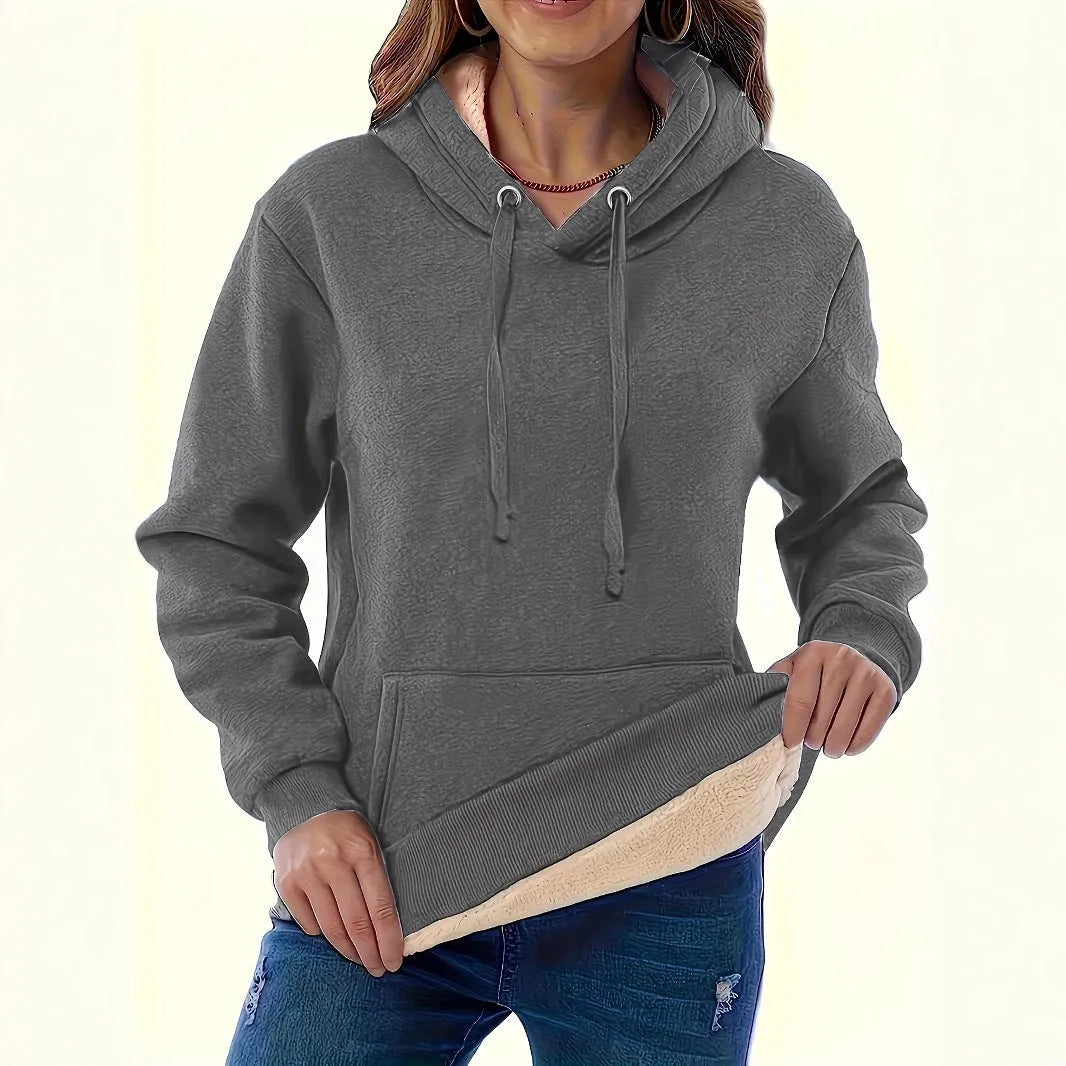 Women's black hooded sweater with a raised 3D pattern, featuring a loose fit and long sleeves.