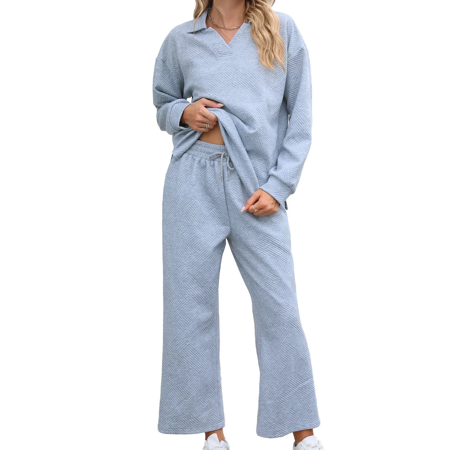 Women's solid colour knitted suit set with lapel top and cropped trousers in gray.