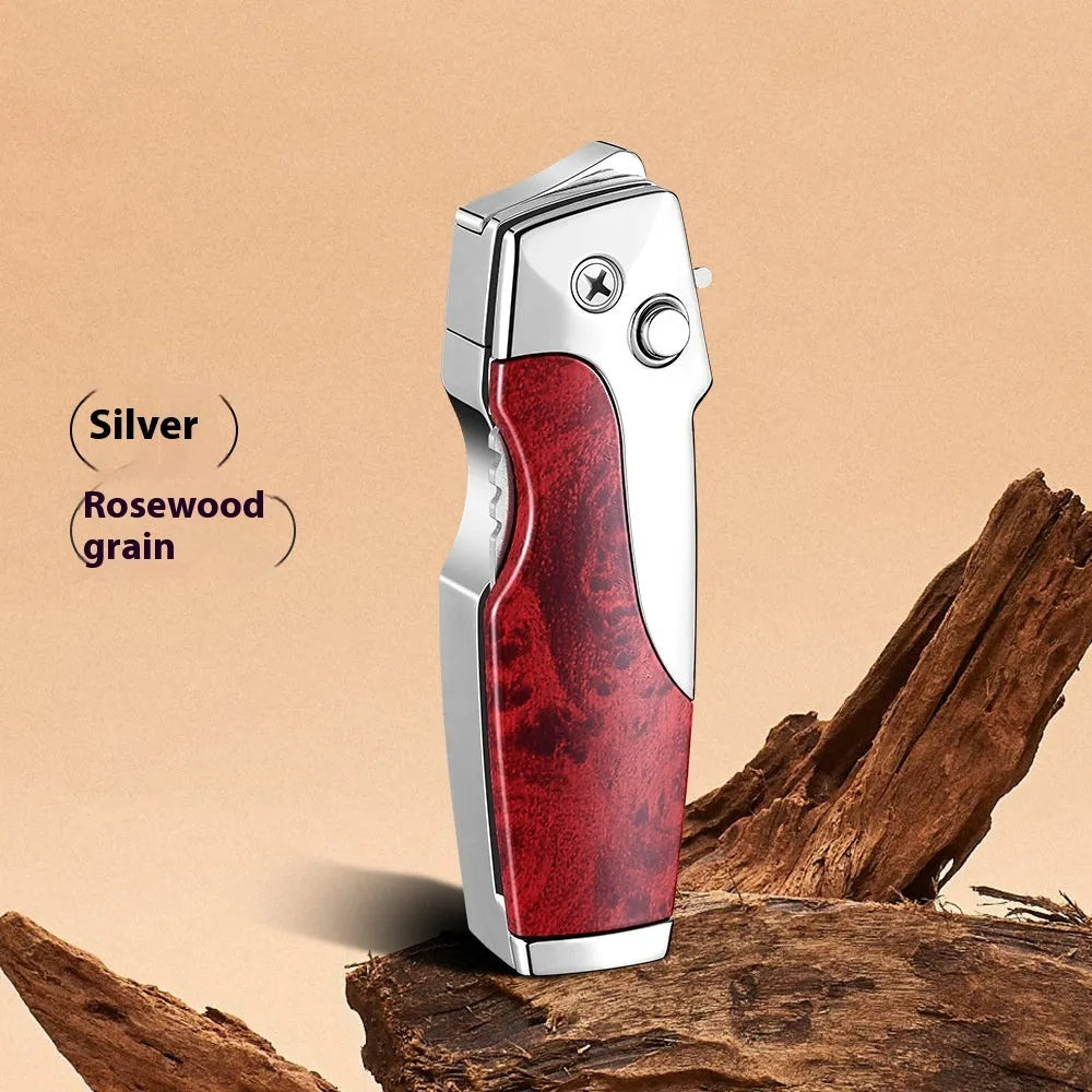 Zinc alloy folding lighter tool with integrated pocket knife blade, shown in a selection of wood grain and carbon fibre finishes.