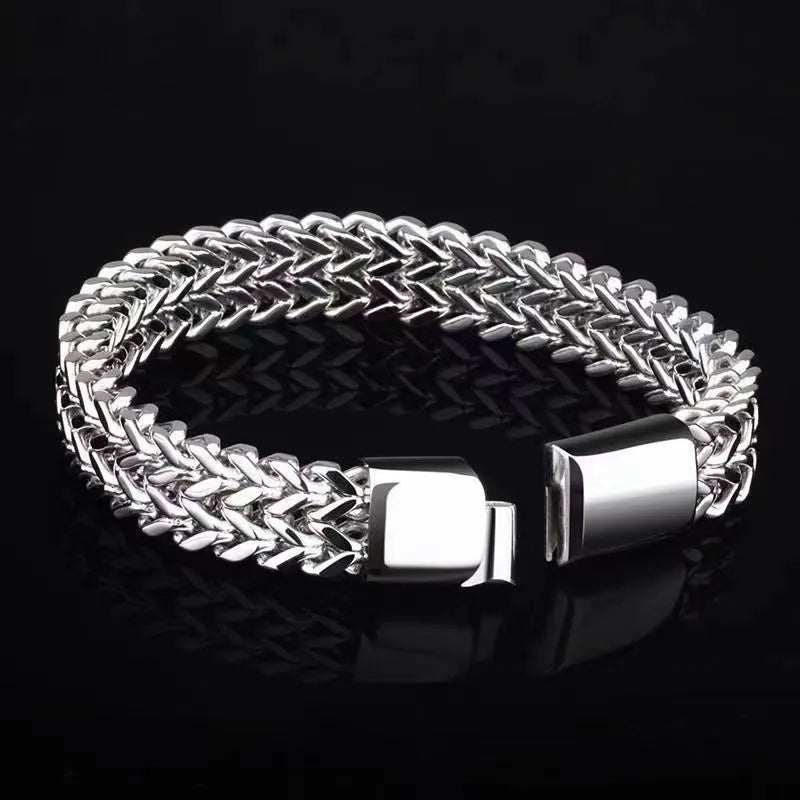 Geometric titanium steel unisex bracelet in silver showing simple front and back design.
