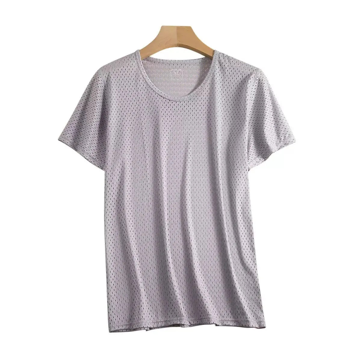 Man wearing a loose-fit grey ice silk short sleeve t-shirt on a summer day.