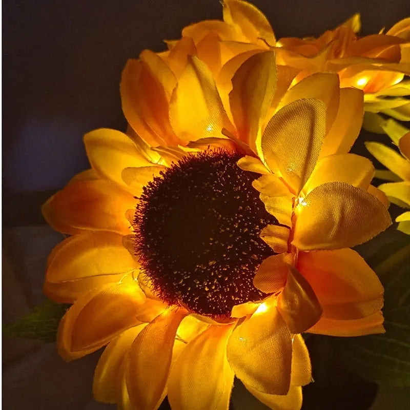 Rechargeable sunflower simulation LED night light table lamp with artificial flowers on a wooden table