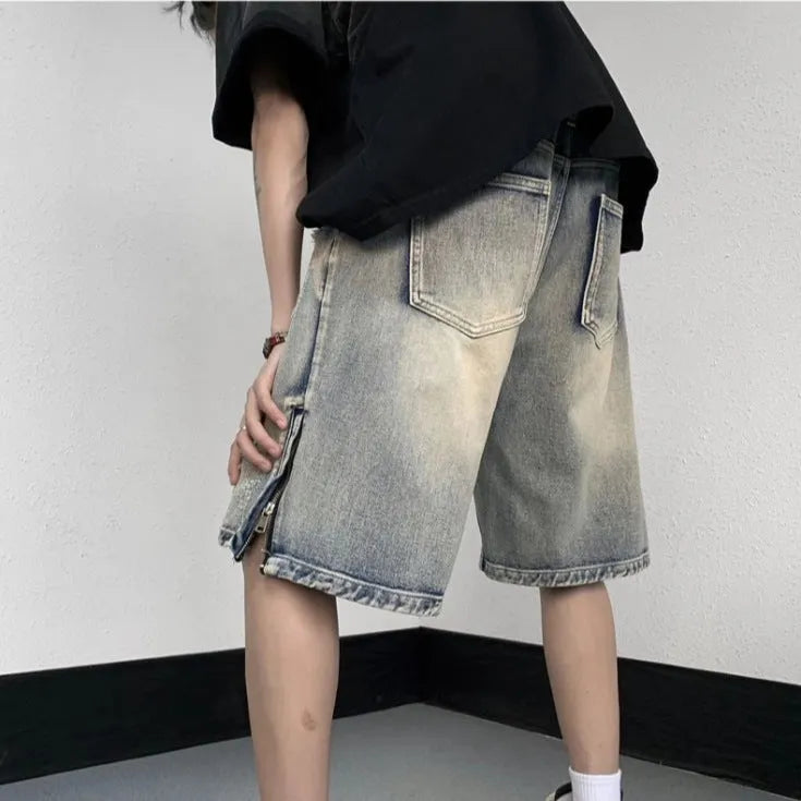 Blue retro tattered denim shorts with wide leg fit and distressed detailing
