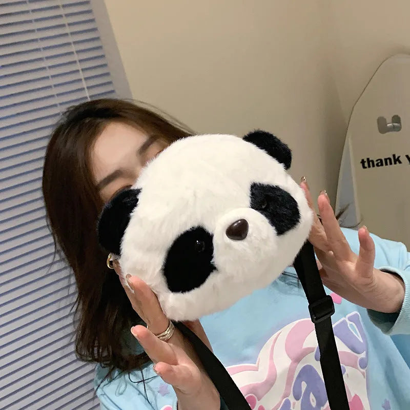Plush cylindrical crossbody bag with panda head design measuring 18cm