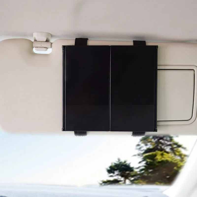Silver car folding makeup mirror shown both closed and opened to show size difference