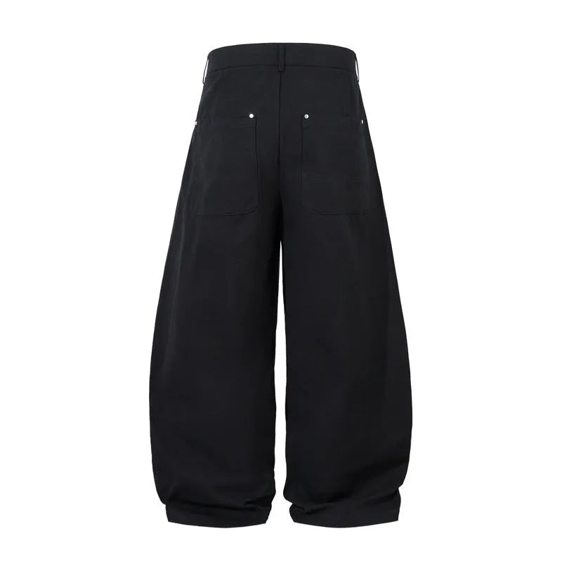 Black men's wide-leg casual trousers with front pleated machete detailing on a mid waist.