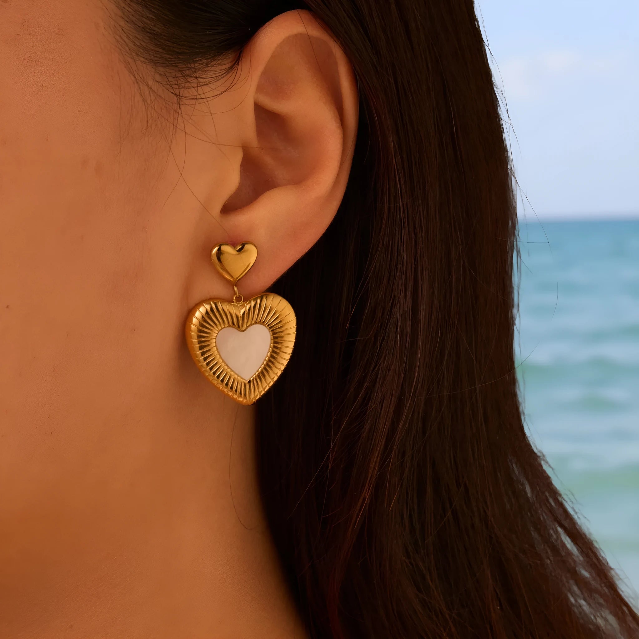 Heart shaped stainless steel earrings with white fritillary pattern and 18K gold electroplated finish for women