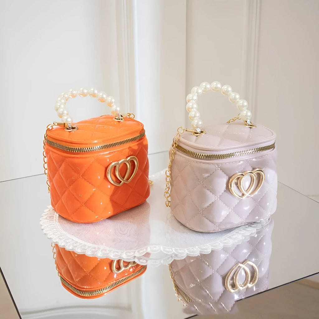 Women's PVC bucket shoulder bag with heart pattern in assorted colours