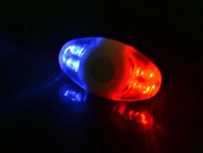 Red and blue LED bicycle tail light with adjustable mounting bracket.