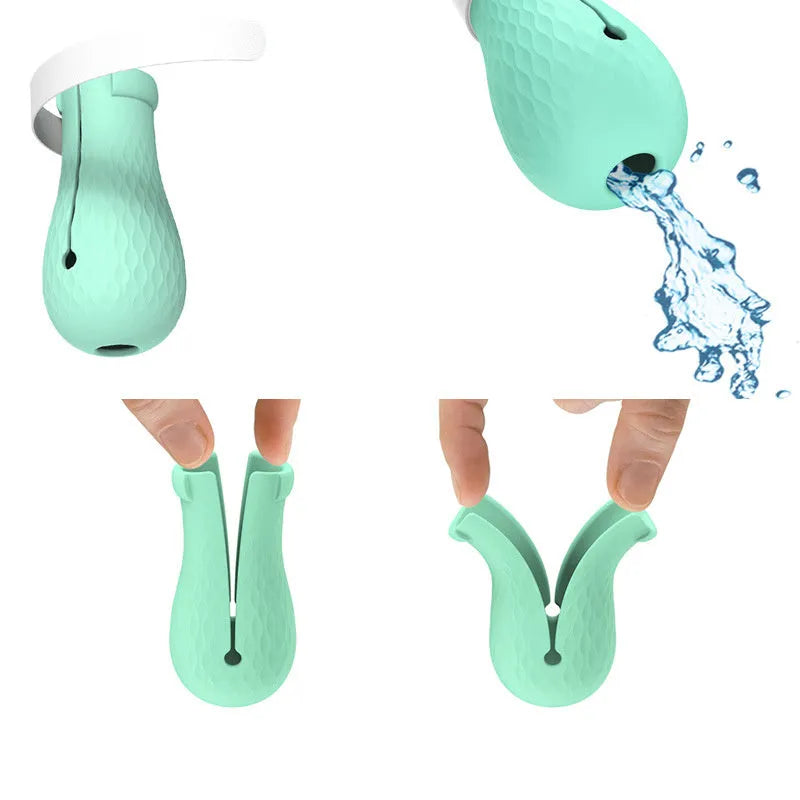 Green silicone cat paw covers with straps for scratch protection during washing and medical procedures