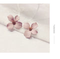 Flower shaped stud earrings for women in pink and white colours