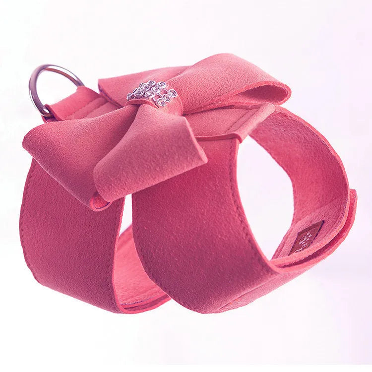Cute pink microfiber dog chest strap harness with a large bowknot decoration and a metal D-ring.