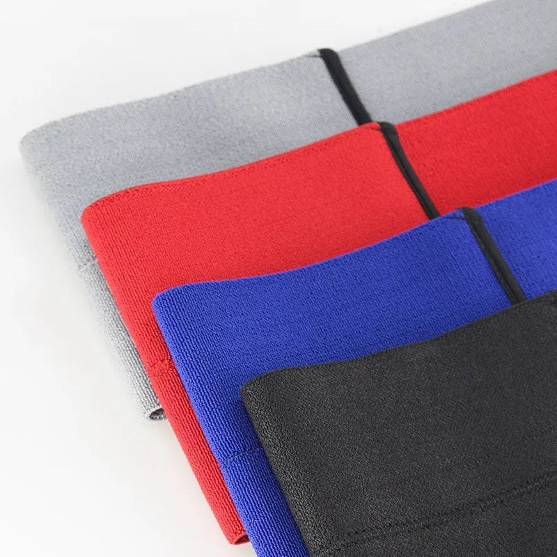 Elastic elbow support bandage in black, shown wrapped around an elbow, for boxing and exercise.