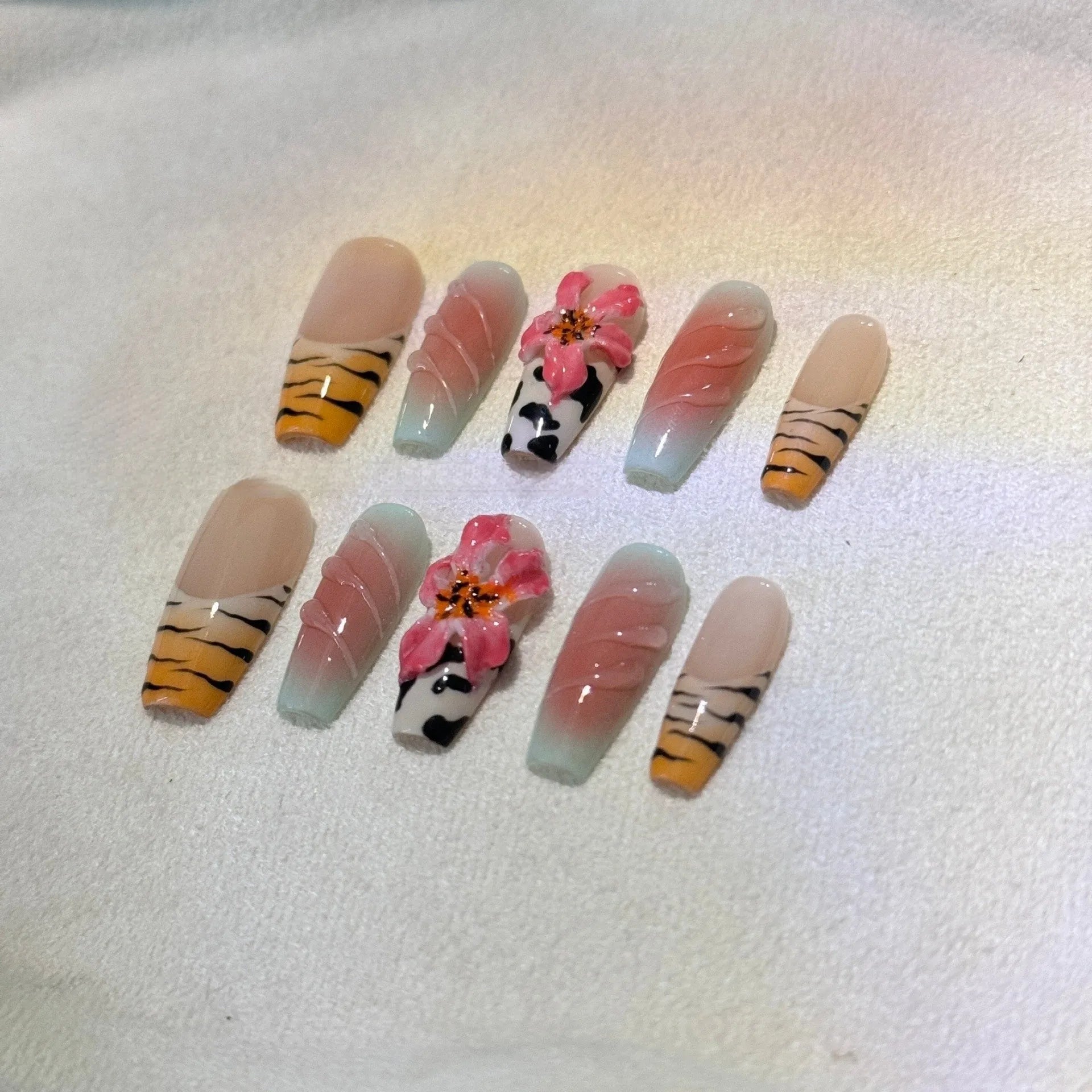 Lily and zebra pattern hand-carved press-on nail art set in a long, wear-resistant style.