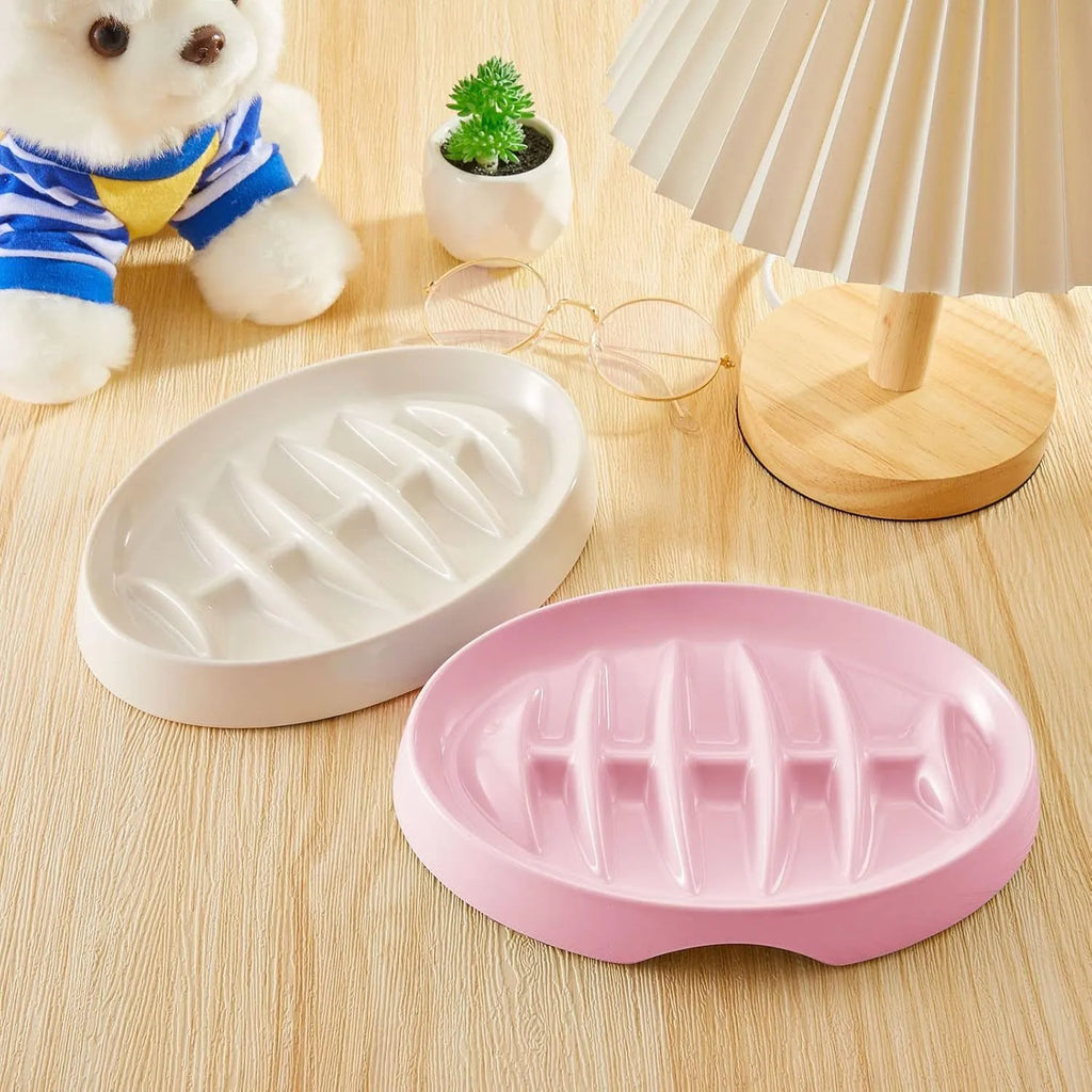 Green melamine fishbone slow feeder bowl for cats with raised ridges on a plain background