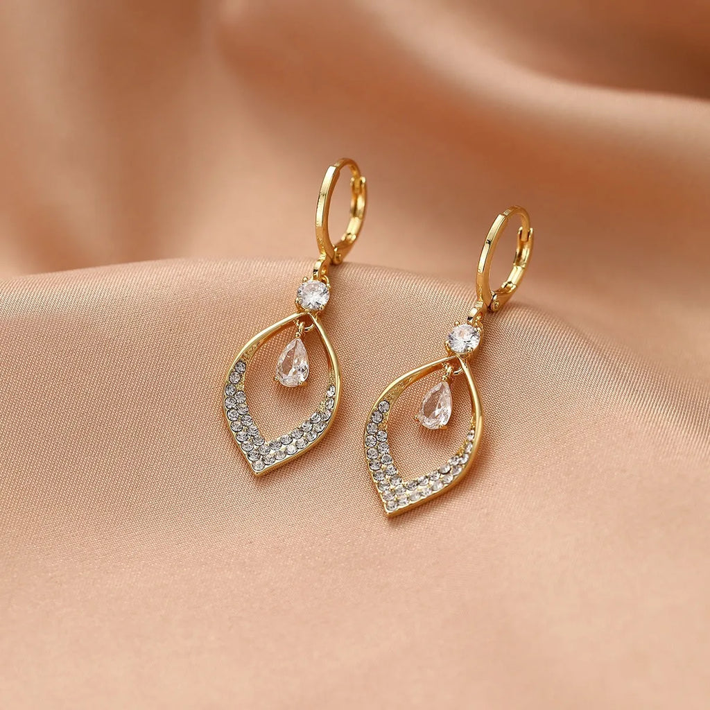 Gold electroplated copper zircon water drop tassel earrings in a teardrop shape
