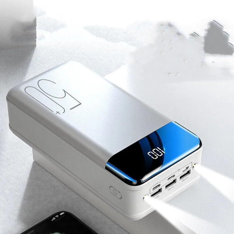 Black or white 50000mAh power bank with three USB output ports showing size scale