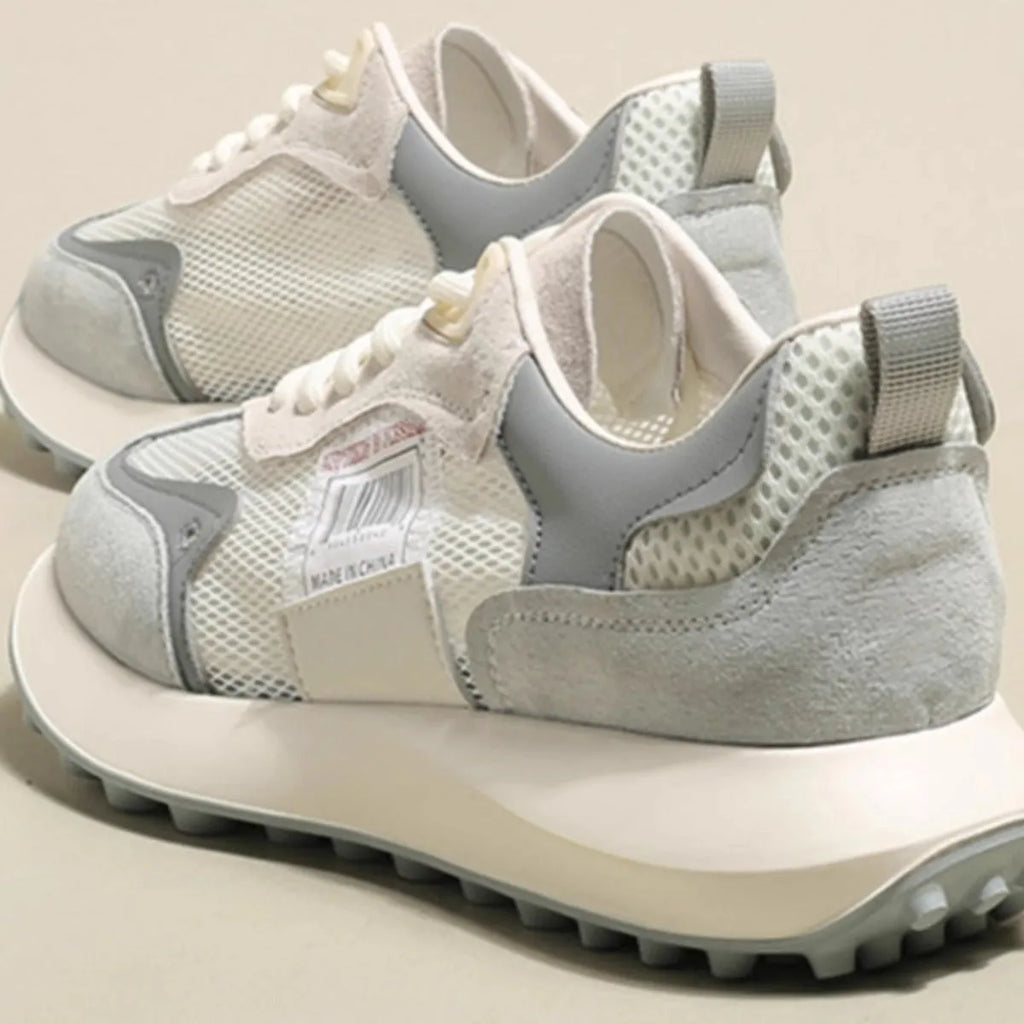 Women's low-top retro sneaker in grey with round toe, rubber sole, and shallow-cut design under 7cm.