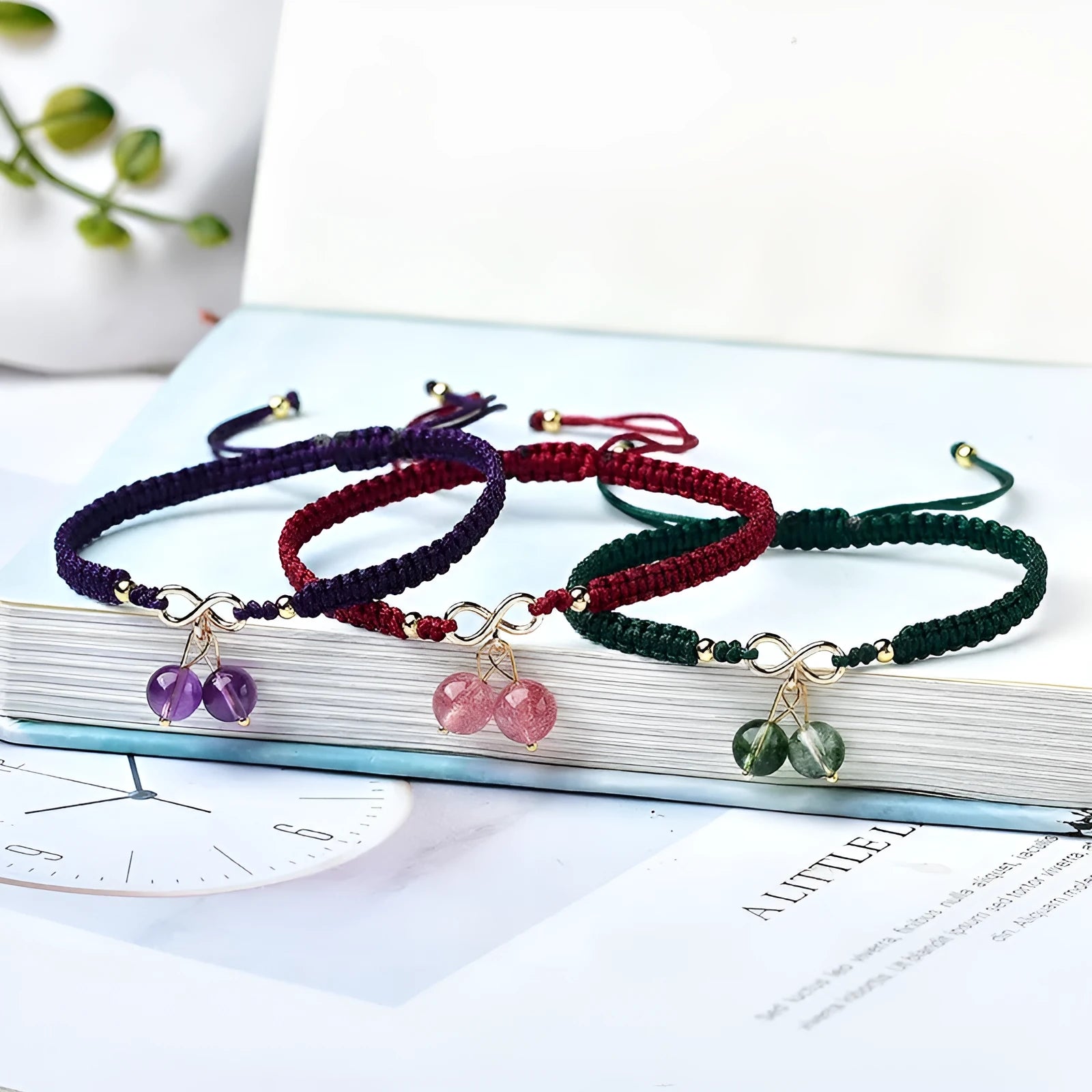Women's natural strawberry quartz crystal bracelet with red cherry-shaped beads on a string.