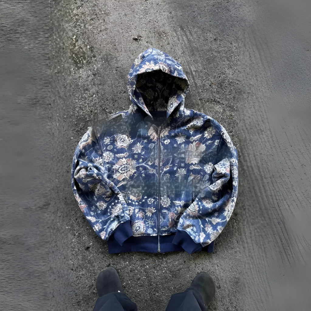 Man wearing a loose blue zip-up hooded coat for casual autumn wear.