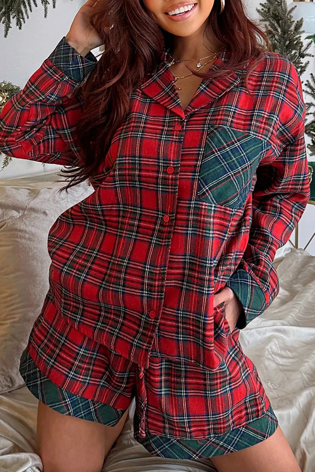Red plaid Christmas pyjama set with contrast patches showing long sleeve shirt and shorts