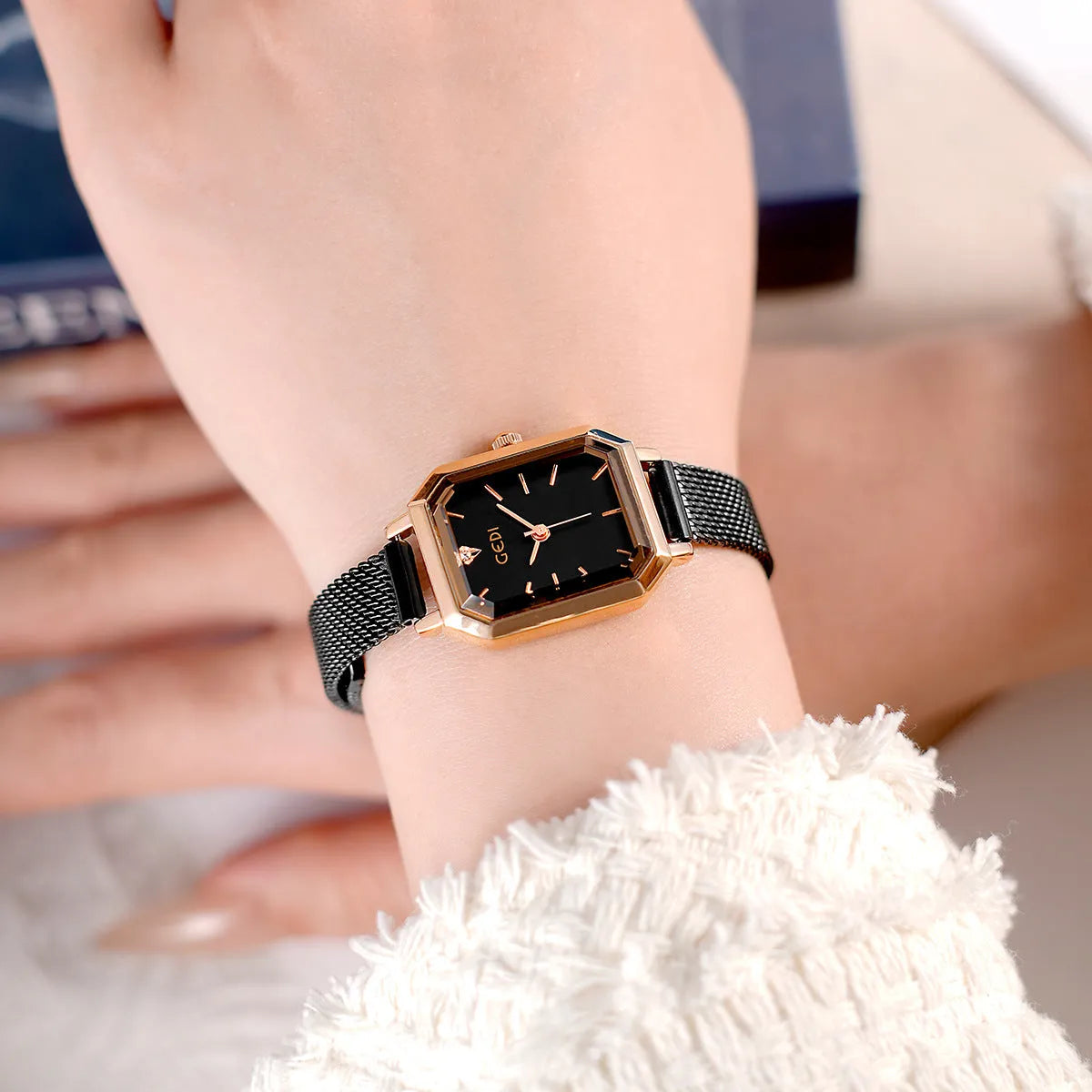 Women's square retro casual watch with rose shell case and thin 8mm profile on wrist.