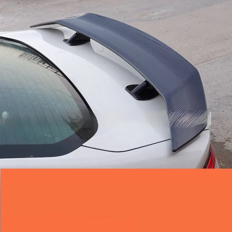 Universal punch-free car tail wing spoiler in ABS material showing four finish options
