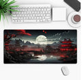 Gaming mouse pad with anime graphic design on a desk, showing non-slip rubber cloth base