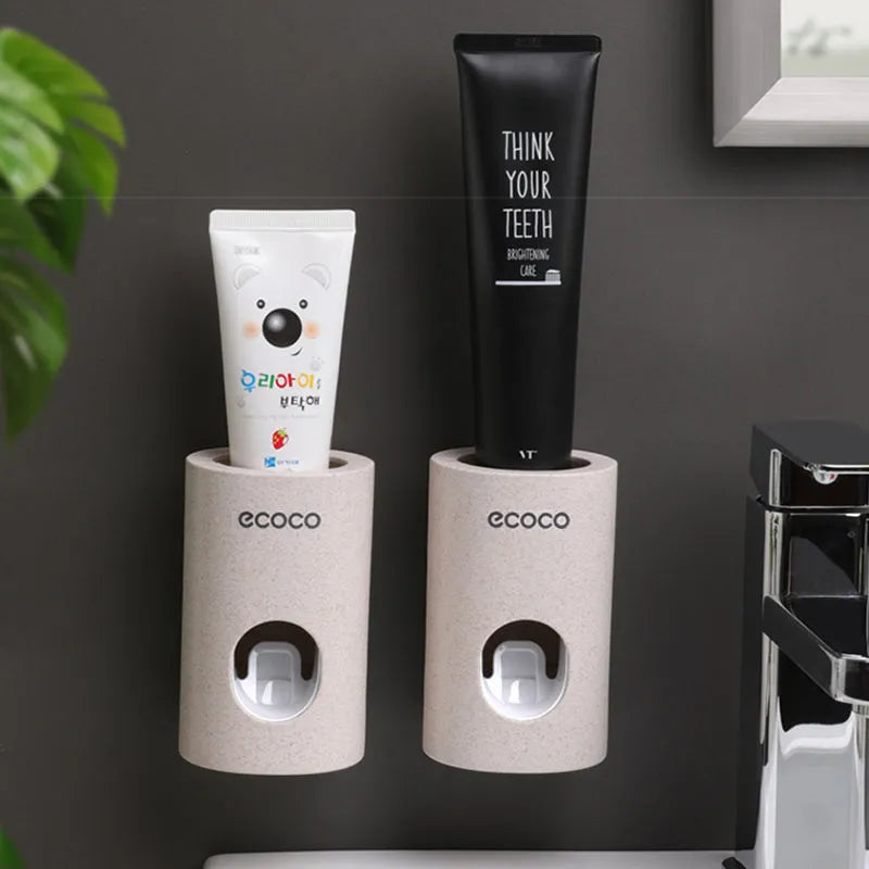 Two Ecoco single toothpaste dispensers in simple modern style, 15-18cm, on a bathroom countertop