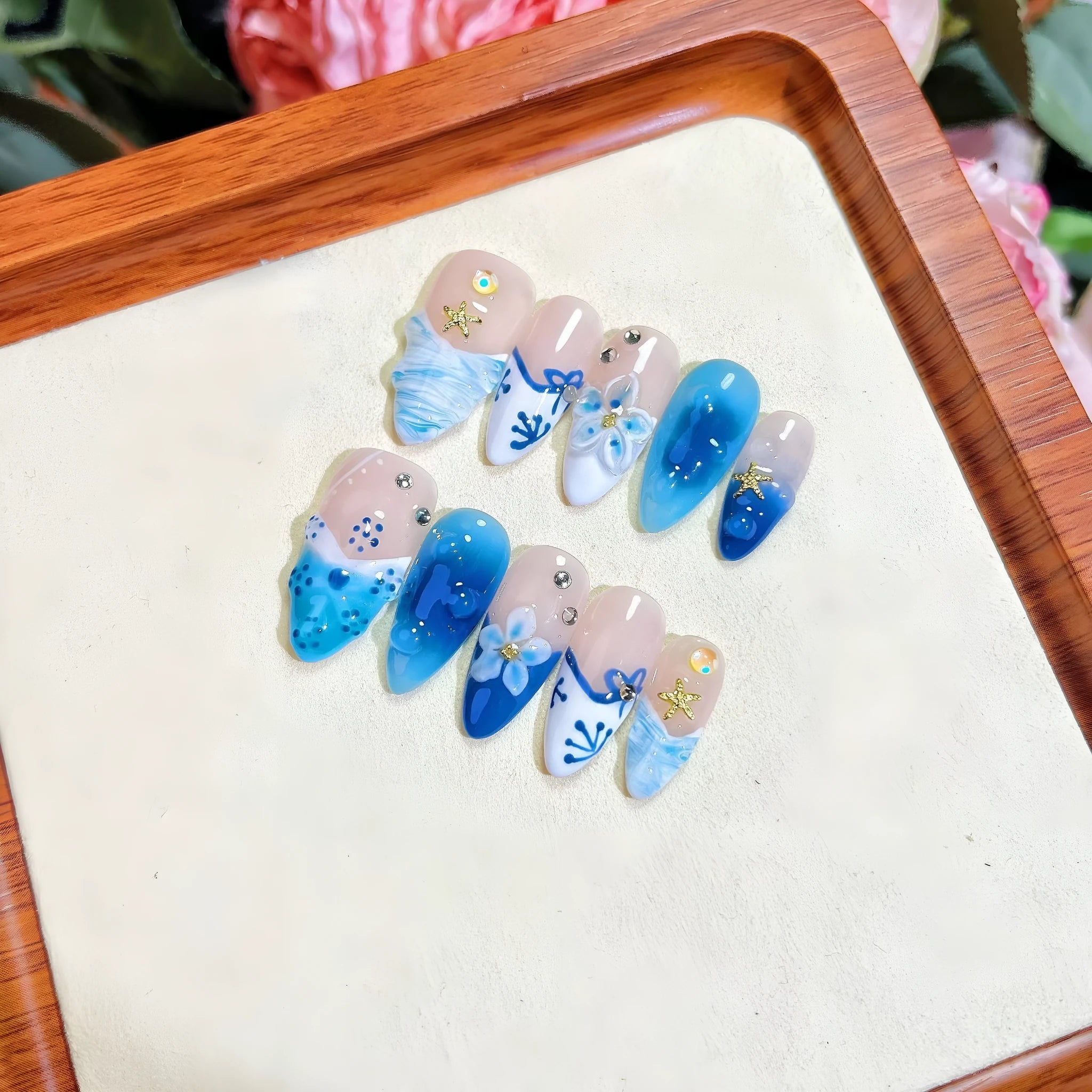 Blue hand-painted carved fake nails on transparent base with four size options