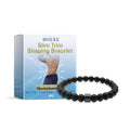 Men's black gallstone and glass body shaping bracelet on wrist.