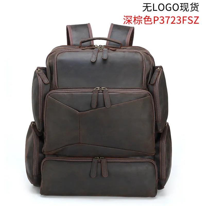 Dark brown genuine leather 17-inch laptop backpack with double straps and multiple pockets.