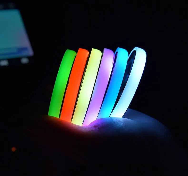 Colourful LED light-up coaster for car cup holder showing seven changeable colours and USB cable.