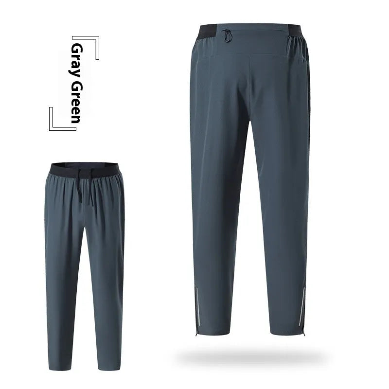 Men's loose quick-drying polyester sports trousers in navy blue, mid-waist with an American style cut for running and fitness