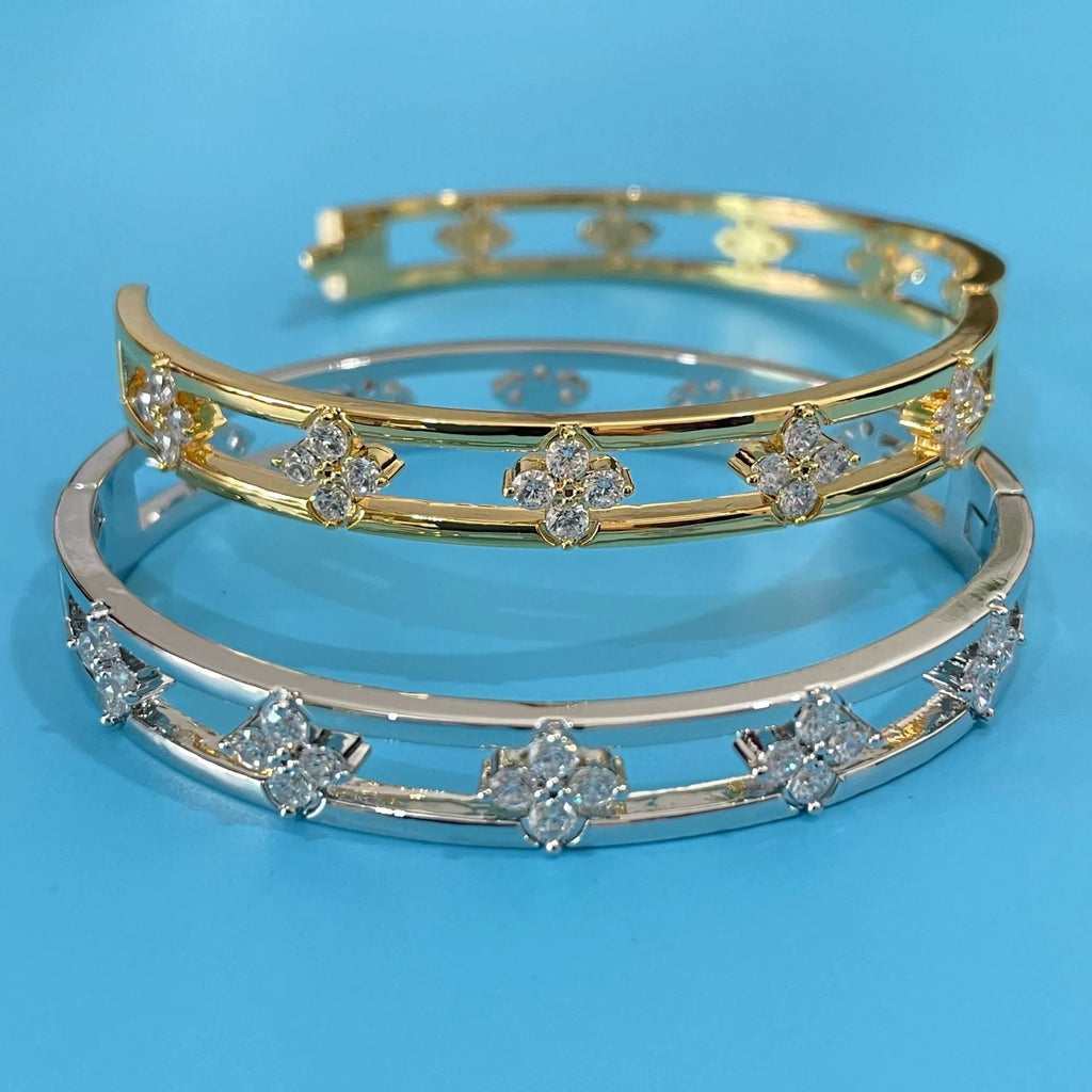 Women's hollow bracelet with four-leaf clover design in gold or silver options