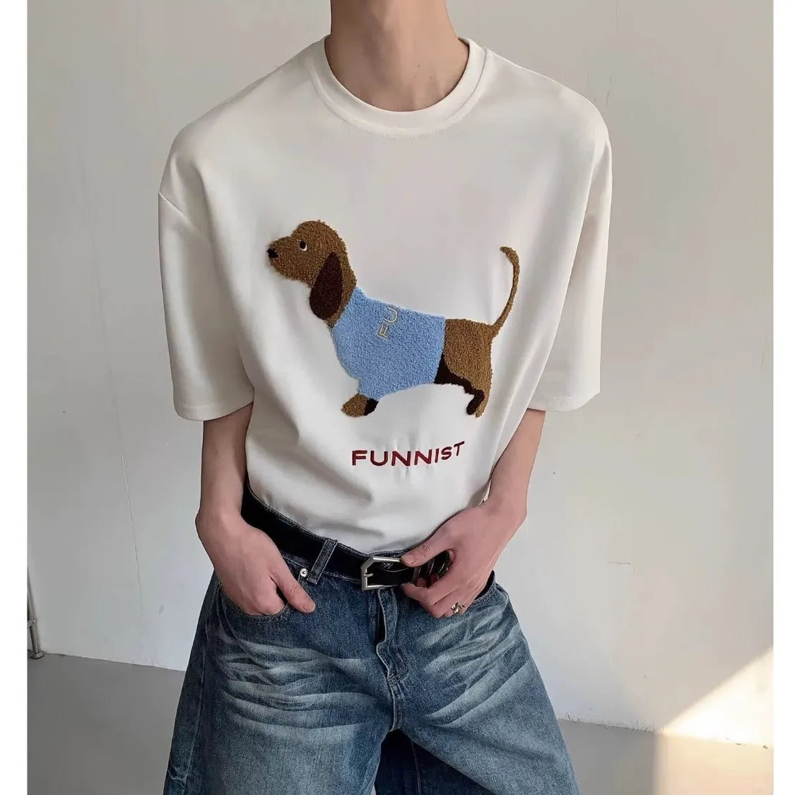 Grey men's round neck T-shirt with an embroidered brown sausage dog design on the front.