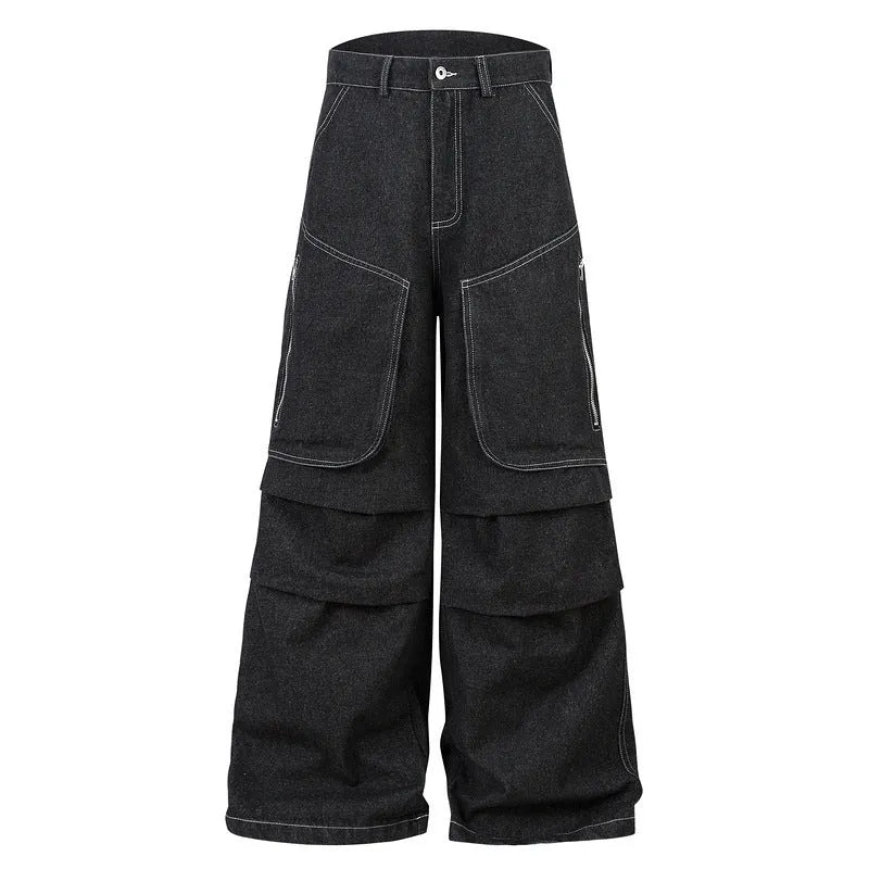Black multi-pocket pleated workwear jeans made from cotton denim on a plain background.