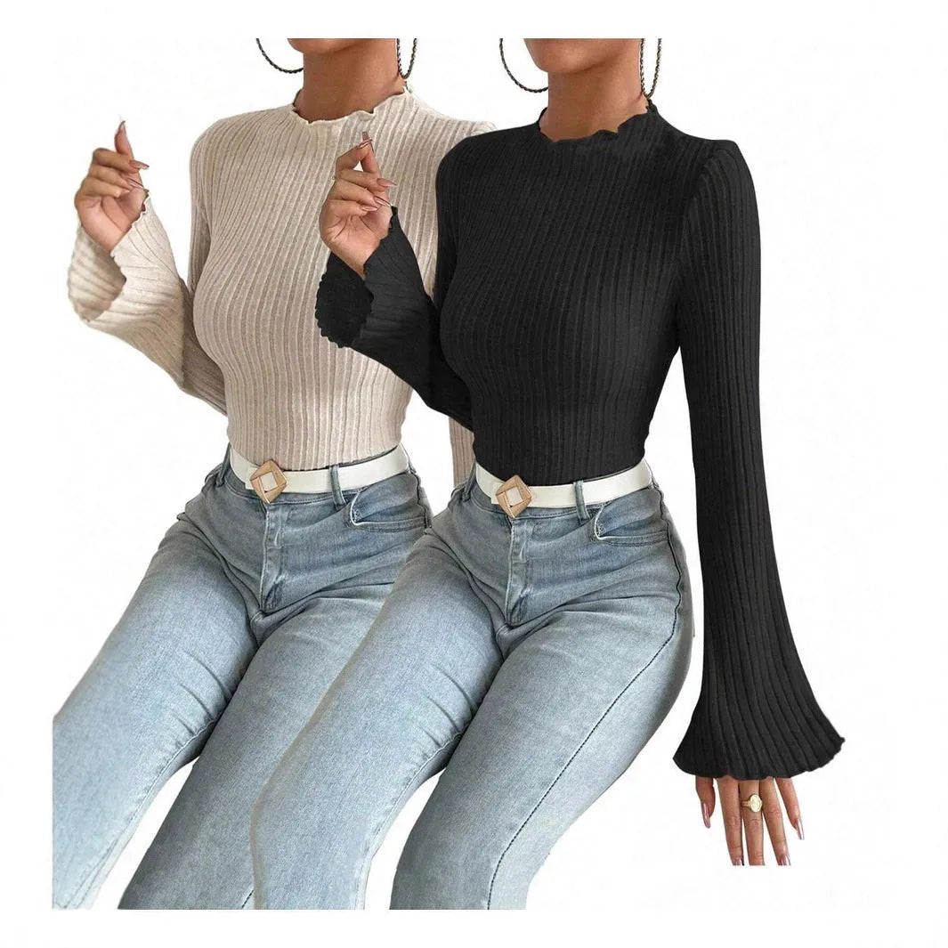 Black slim fit long sleeve top with lantern sleeves and a round neckline on a mannequin.