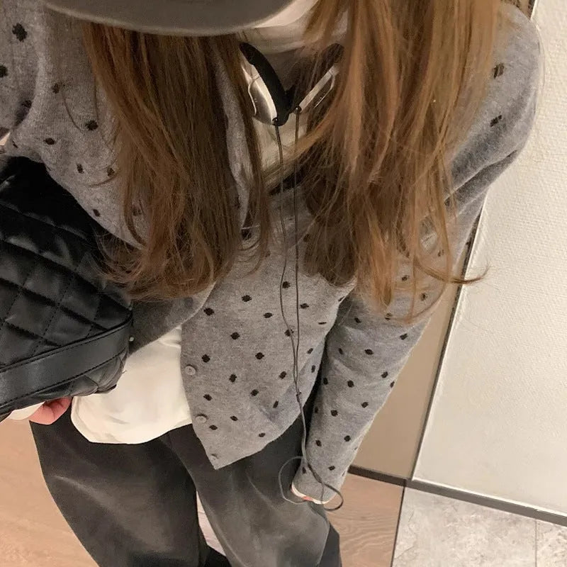 Women's gray dot knitted cardigan with crocheted flowers in black or gray.